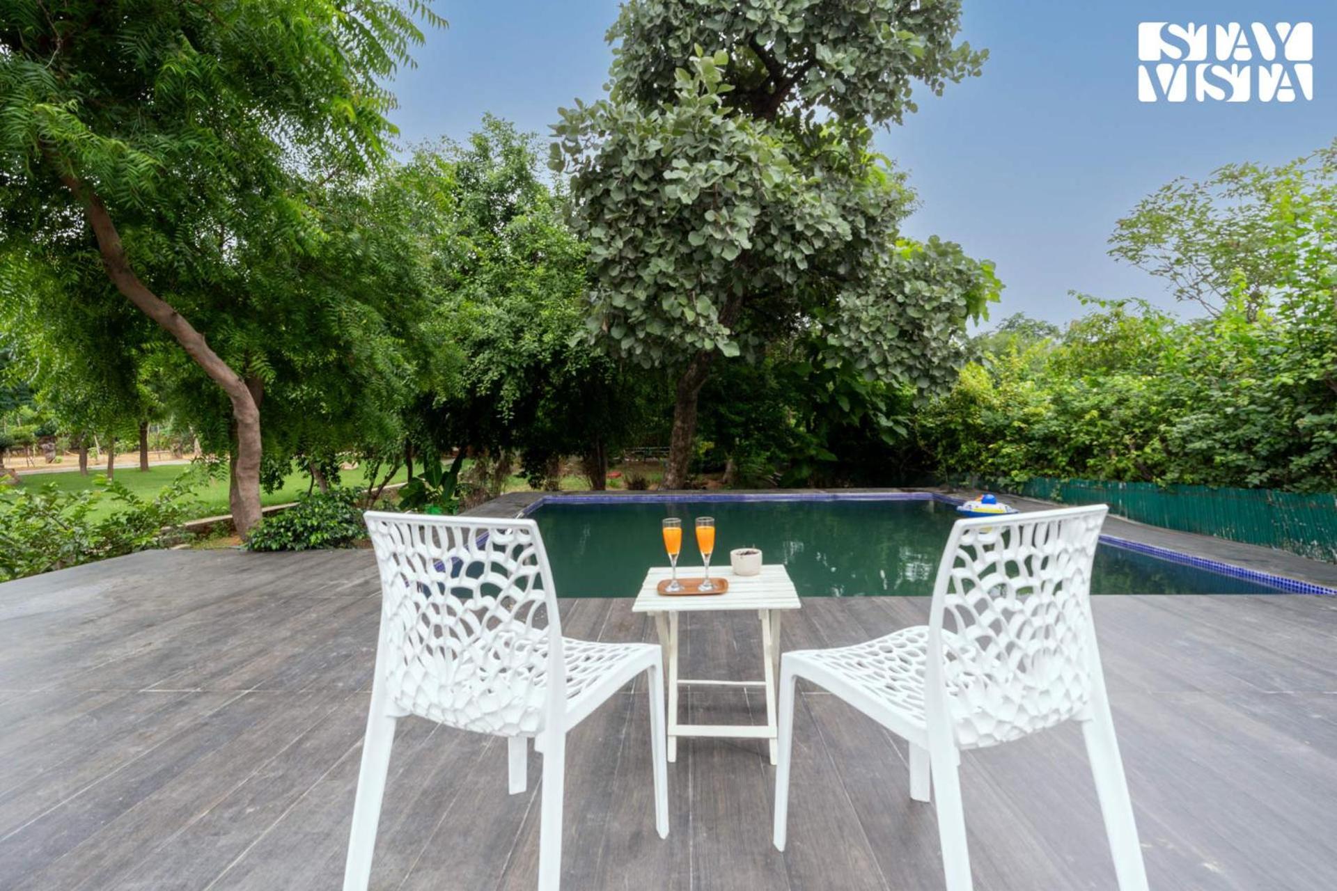 Stayvista's Glasshouse: Orchard Farmstay with Pool and Relaxation Gurgaon Exterior photo